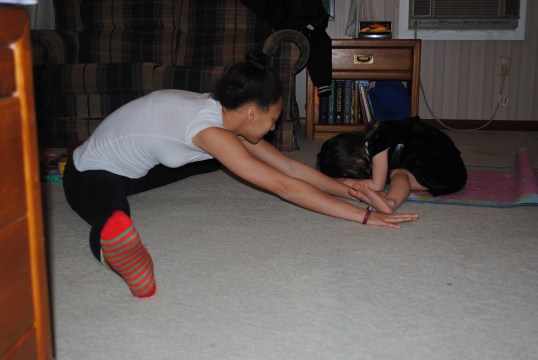Both of their cousins are dancers in high school. Here they are teaching D. how to stretch the right way