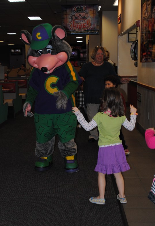 She's giving her big monster roar to Chucky Cheese