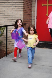The girls racing at the beginning of their Easter Egg hunt