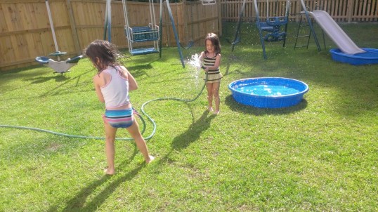 Yes, Chum leaped over both pools in one giant stretch, but not while the girls had the hose out