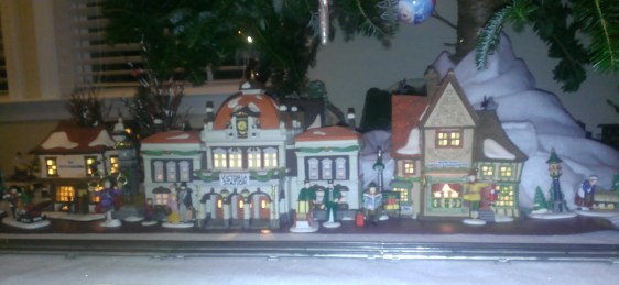 Busy night in front of VS's complete with a man and is five golden rings