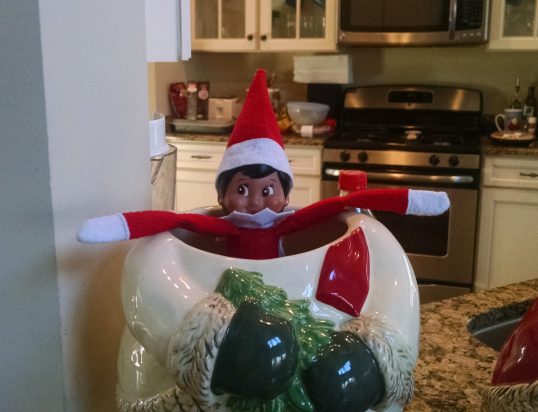 Elf Lana pretending she's a snowman